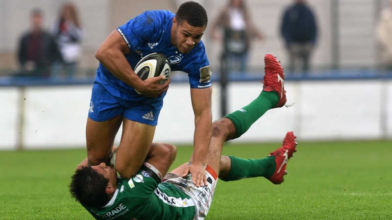 Adam Byrne bundles past Ignacio Brex of Benetton