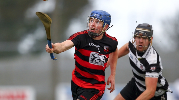 Ballygunner's Tim O'Sullivan pursued by Midleton's Finbar O'Mahoney