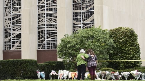Women embrace at a memorial outside the Tree of Life Synagogue in Pittsburgh