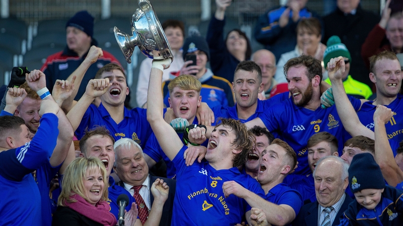 Ian Maguire lifts the cup