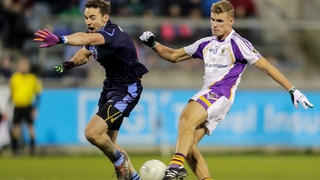 Callum Pearson and Chris Guckian of St Jude's compete for the ball