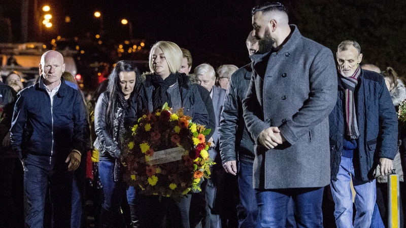 Daughter of John Burns, Gillian holding a wreath during a vigil to mark the 25th anniversary of the UFF attack