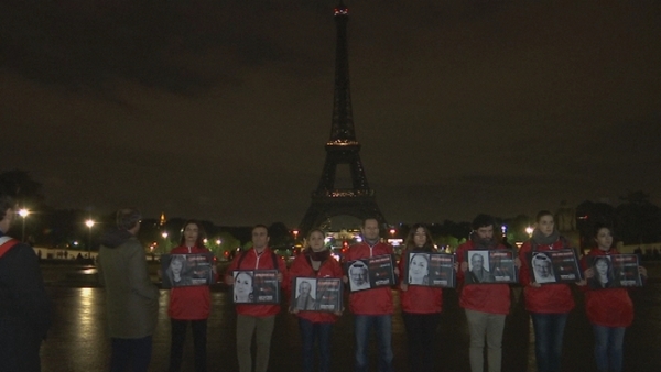 Members of French NGO Reporters Without Borders gathered in front of the Paris landmark