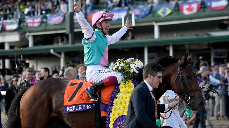 Frankie Dettori celebrates his win about Expert Eye