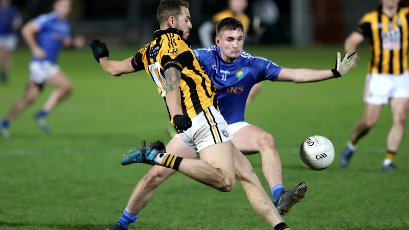 Crossmaglen's Rico Kelly with Cormac O'Hagan of Coalisland