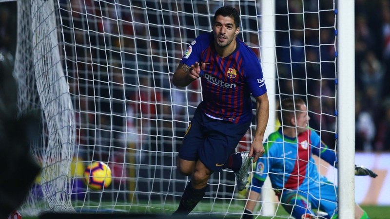Luis Suarez celebrates scoring Barca's third goal