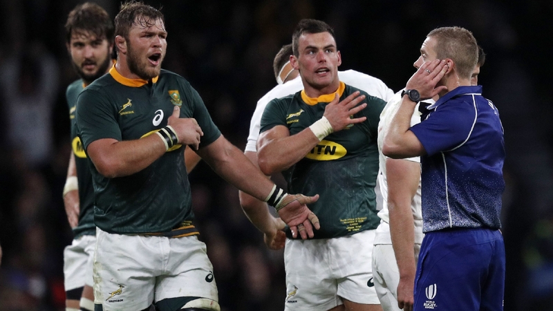 Referee Angus Gardner (R) decided Farrell had attempted to wrap his arms in the tackle