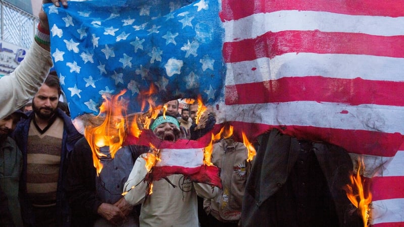 Iranian protesters burned the US flag on the eve of renewed sanctions by Washington