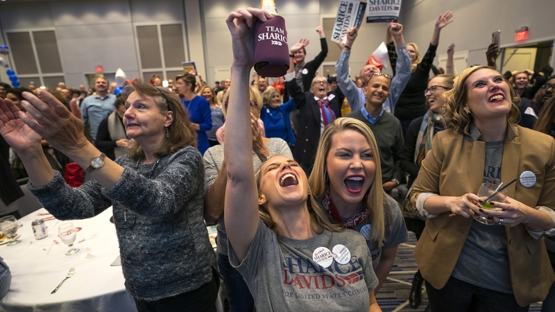 Supporters of Democratic House candidate Sharice Davids cheer after learning of her election