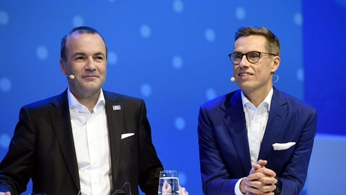 Manfred Weber (L) and Alexander Stubb take part in a debate at the EPP's congress in Helsinki
