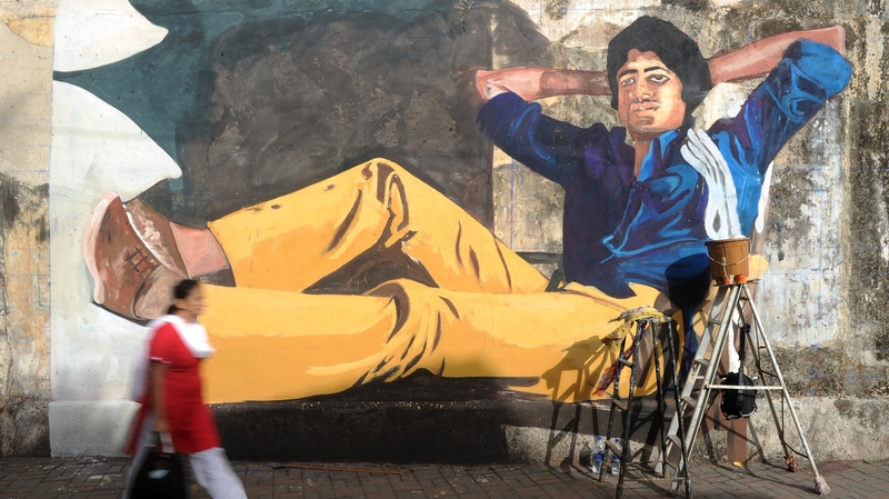 Mural on a Mumbai wall of Bollywood actor Amitabh Bachchan from his classic film Deewar. Photo: Indranil Mukherjee/AFP/ Getty Images