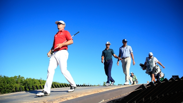 Zach Johnson, Billy Horschel, and Matt Kuchar walk off the 17th