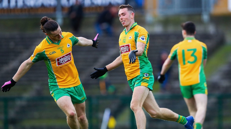 Jason Leonard and Kieran Molloy celebrate the former's opening goal in their one-sided win over Clann na nGael