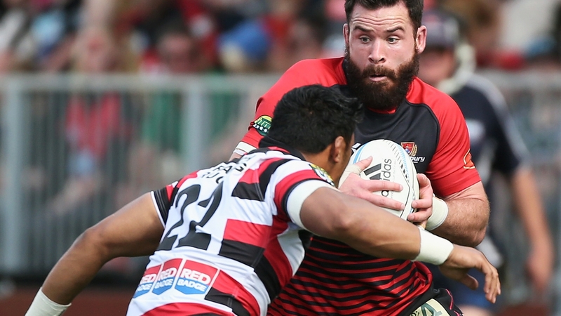 Ryan Crotty of Canterbury gets tackled by Counties Manukau centre Bundee Aki in 2013