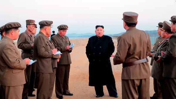 The only picture released by state media showed Kim Jong-un standing on a beach surrounded by officials in military uniforms, but no weapons were visible