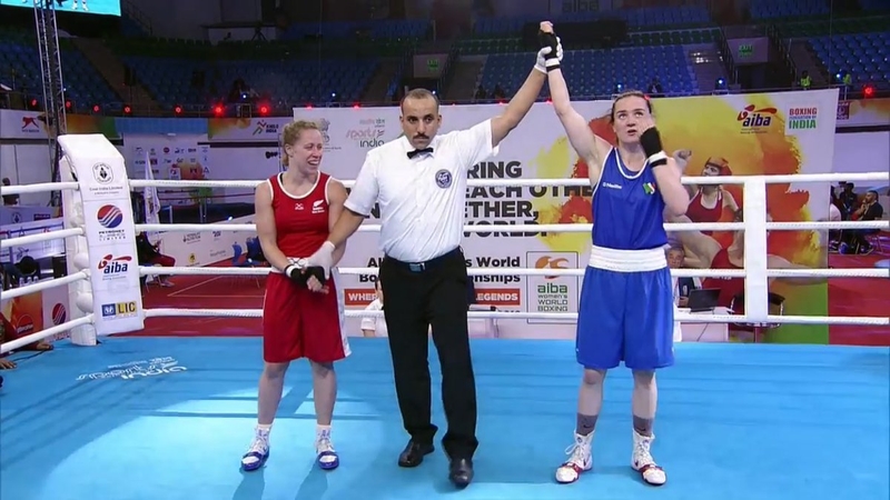 Kellie Harrington has her hand raised in victory