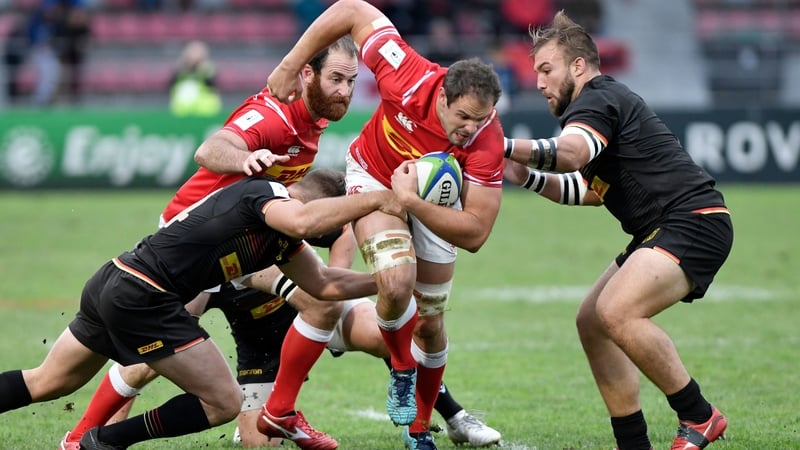 Canada's scrum half Phil Mack tries to escape a tackle