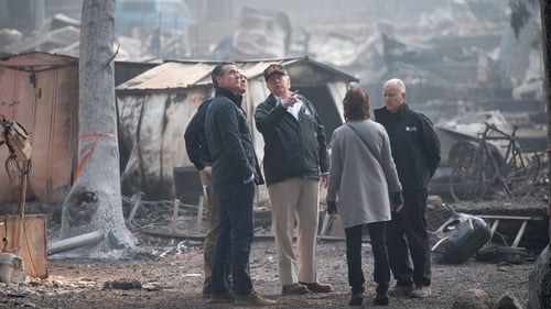 US President Donald Trump (centre) visits the ravaged town of Paradise in California