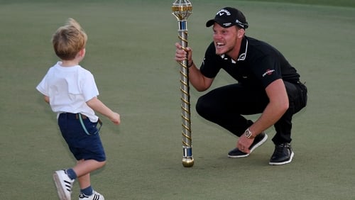 Danny Willett celebrates with his son