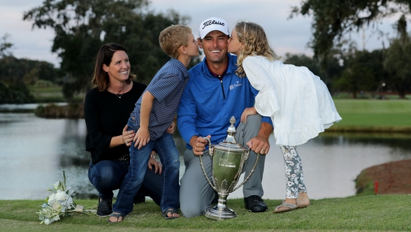 Charles Howell III of the United States poses with his wife Heather and their kids Charles and Ashley