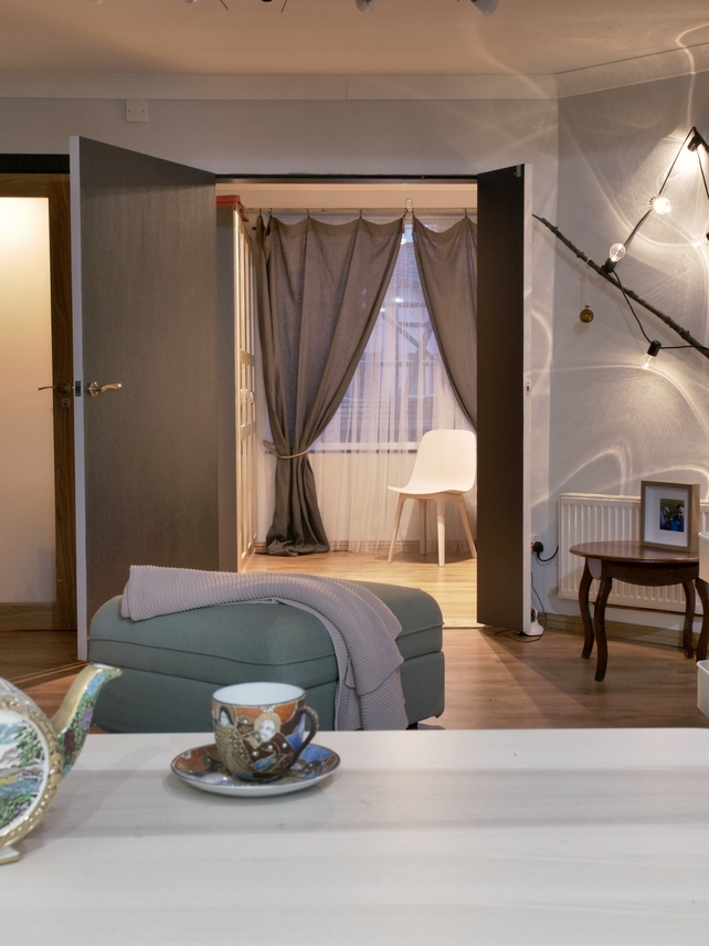 After: Calming greys and unusual trinkets give the room personality