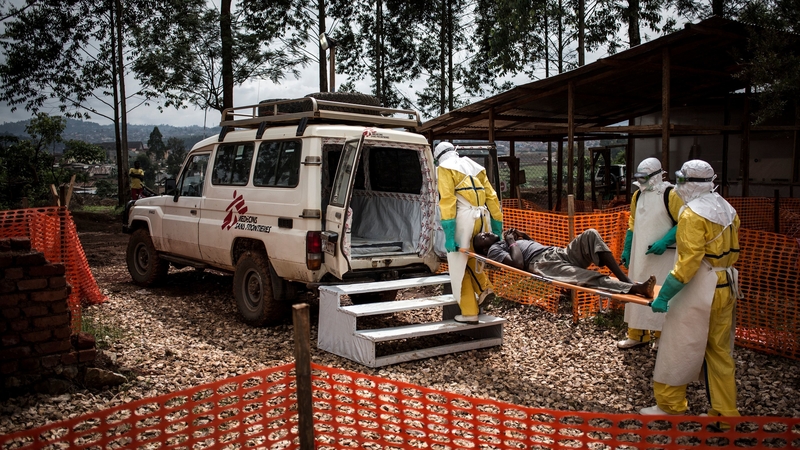 Médecins Sans Frontières health workers move a patient to hospital