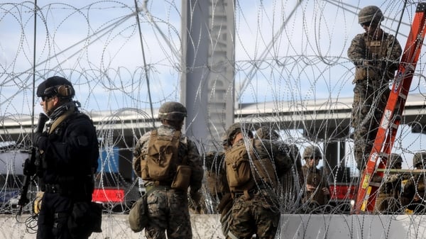 US troops set up barbed wire at the San Ysidro entry point on the border