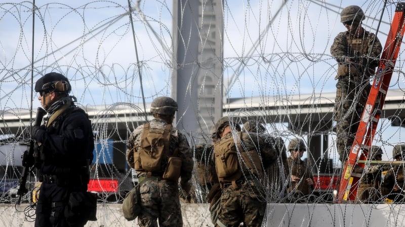US troops set up barbed wire at the San Ysidro entry point on the border