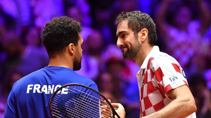Croatia's Marin Cilic (R) shakes hands with France's Jo-Wilfried Tsonga after winning in straight sets