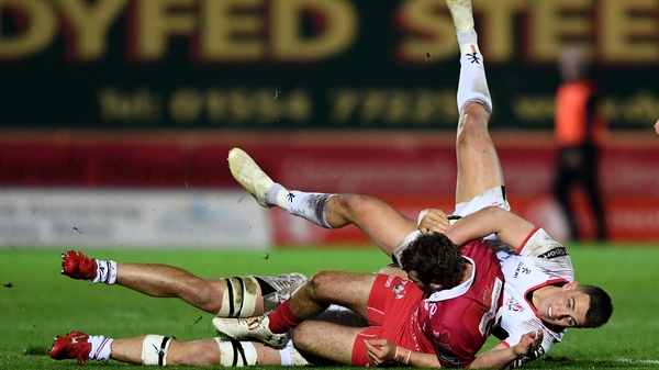 Tom Prydie is tackled by Ulster's James Hume