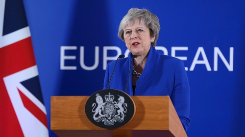 Theresa May speaking at a press conference after today's EU summit
