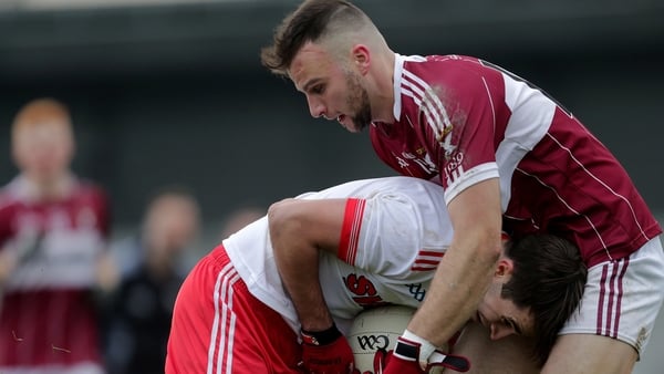 Éire Óg's Fiach O'Toole tackled by Aidan McElligott of Mullinalaghta