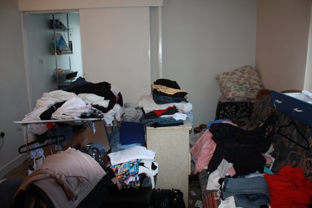Before: Piles of clothes and old furniture blocked the rooms
