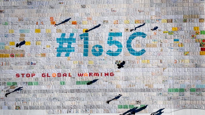 Part of a massive collage of thousands of drawings and messages from children from around the world about climate change in the Swiss Alps