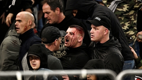 Bloodied spectators inside the stadium