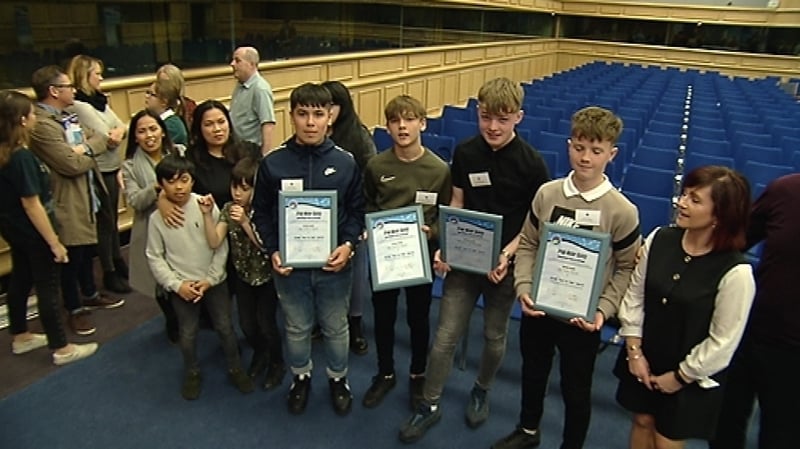 A group of boys honoured for saving a man who had got into difficulty in Galway