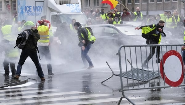Police use water cannon to disperse the protesters