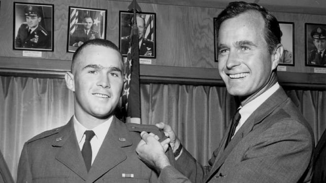 Bush poses with his son and future president George W Bush after he made 2nd Lieutenant with the Texas Air National Guard