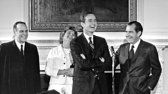 The new CIA director shares a joke with Richard Nixon at his swearing-in ceremony