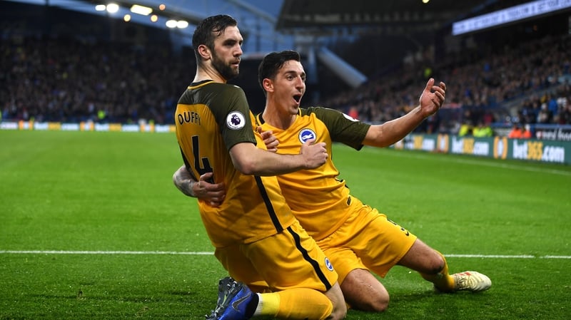 Shane Duffy celebrates his goal with defensive partner Lewis Dunk