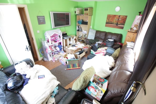 Before: The living room was so packed with clutter that you could barely move in it
