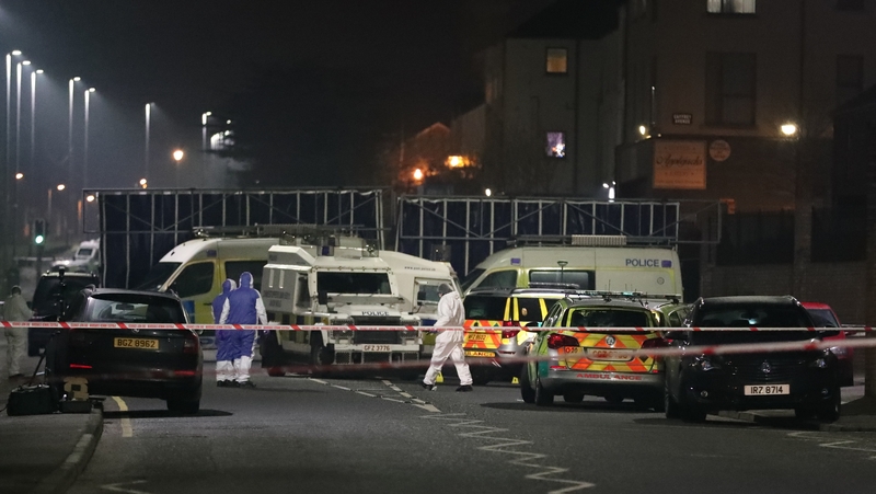 Forensic officers at the scene in Glen Road close to St Mary's Grammar School