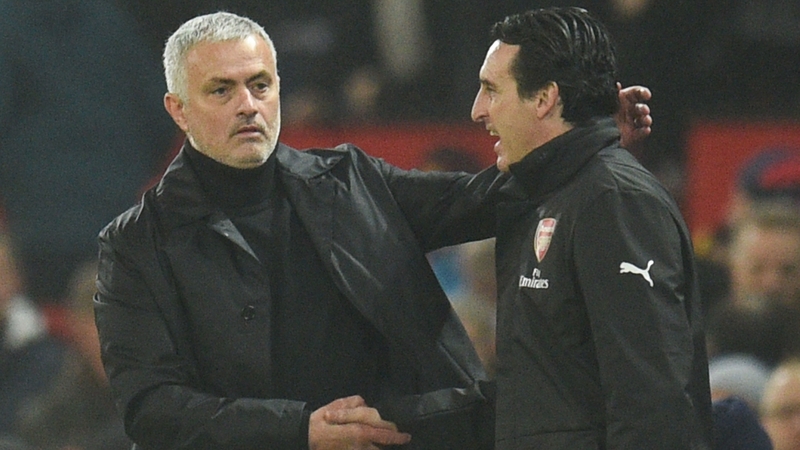 Jose Mourinho (L) shakes hands with Arsenal head coach Unai Emery