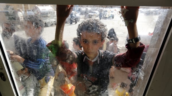 A Yemeni child waits to receive food rations provided by a charity in Sana'a. Over 24 million of the country's 30 million population are in need of humanitarian assistance. Photo: EPA