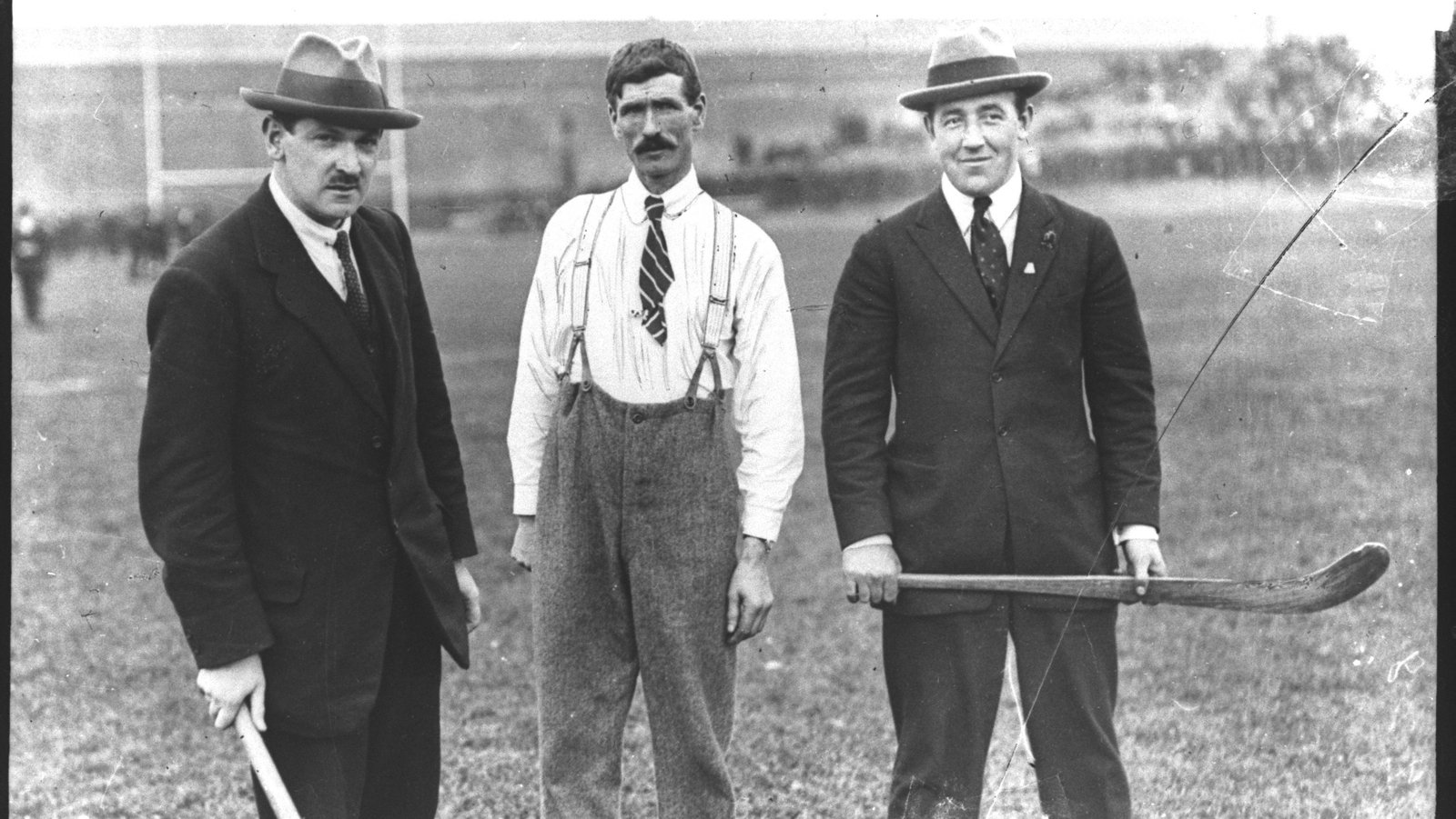 Michael Collins, Patrick Dunphy and Harry Boland, at a GAA hurling match at Croke Park, Dublin 1921. Michael Collins and Harry Boland are both holding hurleys. Photo: RTE Photographic Archive