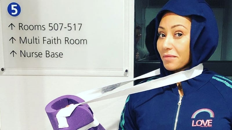 Spice Girl Melanie Brown cancels book signing after suffering two broken ribs and injuring her hand