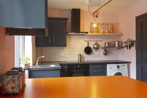 After: A sophisticated colour palette and neat furnishings make the room warm and inviting