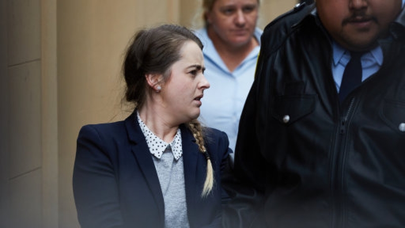 Cathrina Cahill is escorted to a Corrective Services van after her sentencing in the Supreme Court in Sydney