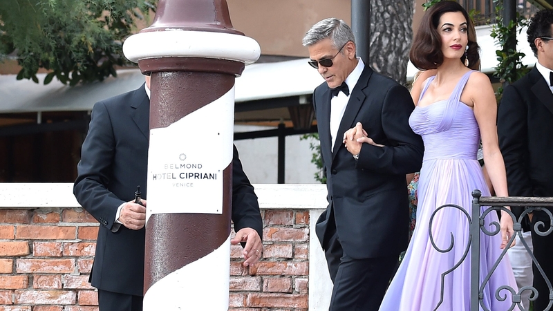 George and Amal Clooney are pictured leaving the Hotel Cipriani in Venice last year