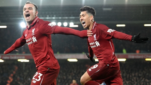 Xherdan Shaqiri (L) celebrates with Roberto Firmino